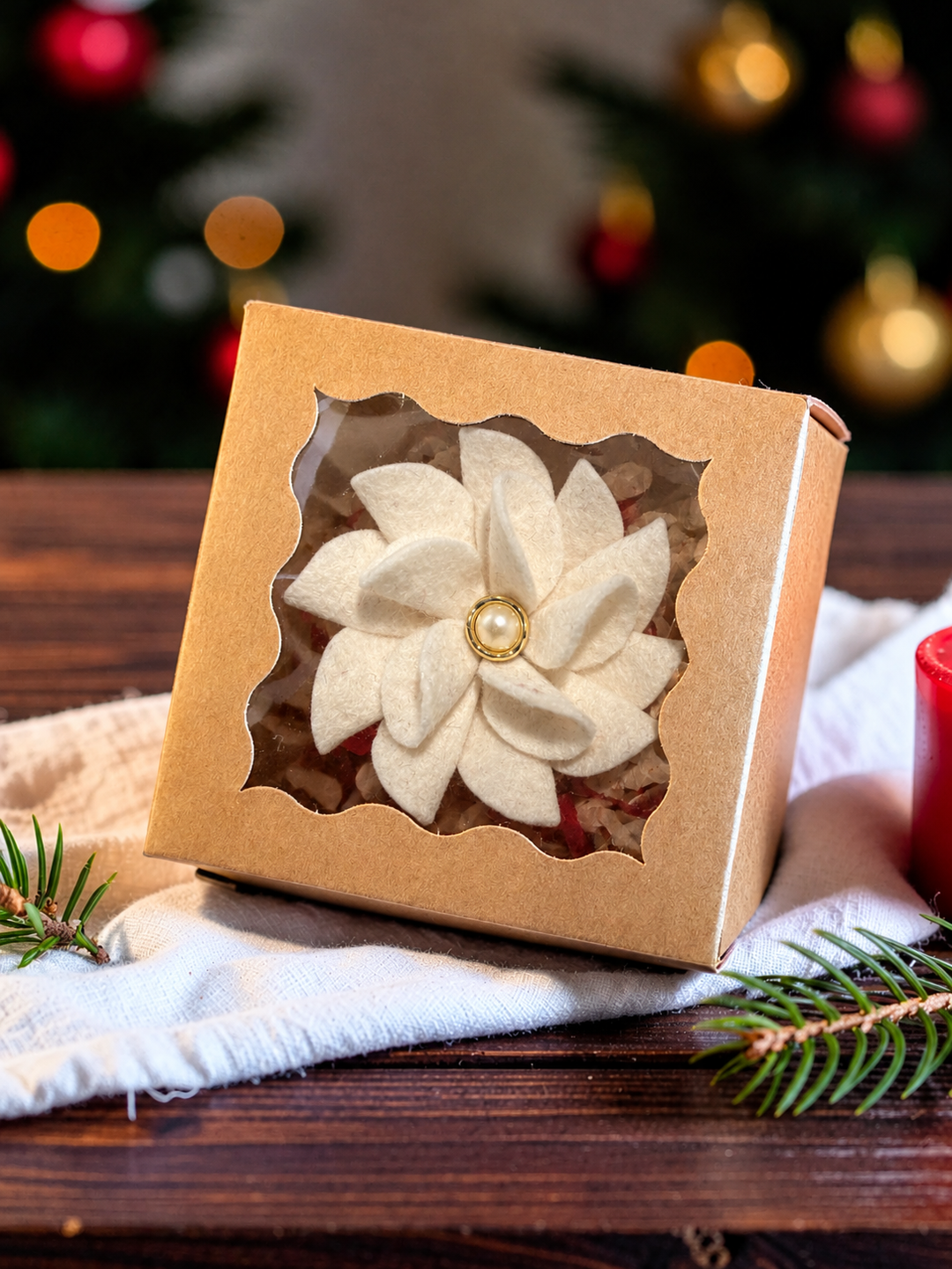 Ivory merino wool felt poinsettia Christmas brooch with a pearl and gold centre