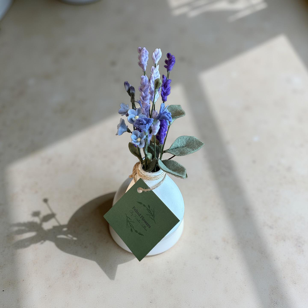 Lavender Blooms in a White Vase