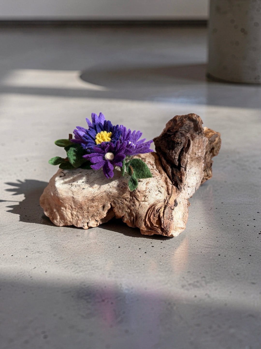 Hand-felted purple wildflower on Saltspring Island driftwood